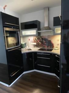 Kuchyň nebo kuchyňský kout v ubytování Appartement Silbermond