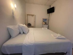 Postel nebo postele na pokoji v ubytování Grand'Hostel