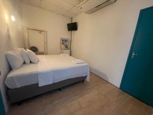 Postel nebo postele na pokoji v ubytování Grand'Hostel