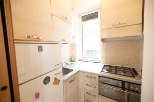 Kuchyň nebo kuchyňský kout v ubytování Magnifico Loft in Zona Udine M2