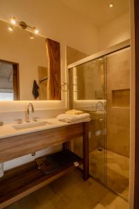 a bathroom with a sink and a shower at Pueblo parvada 24 in Ejido Parras