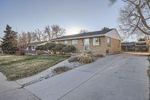 a house with a driveway in front of it at Spacious Denver home in Denver