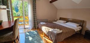 Postel nebo postele na pokoji v ubytování Hotel Koliba na Grza