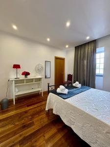 En eller flere senge i et værelse på Casa do Rosário - Ribeira Grande