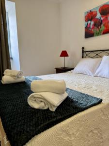 En eller flere senge i et værelse på Casa do Rosário - Ribeira Grande