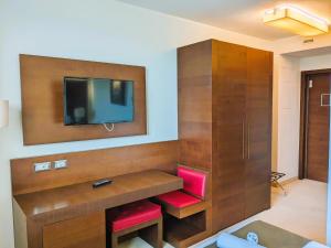 TV a/nebo společenská místnost v ubytování Il Gentiluomo Hotel & SPA