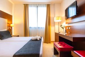 Postel nebo postele na pokoji v ubytování Il Gentiluomo Hotel & SPA