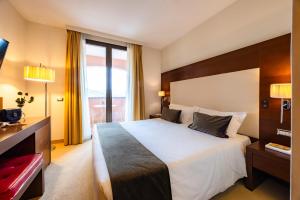 Postel nebo postele na pokoji v ubytování Il Gentiluomo Hotel & SPA
