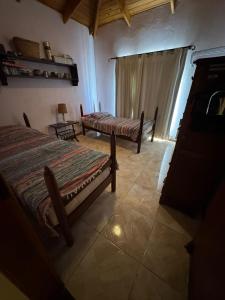 Ένα ή περισσότερα κρεβάτια σε δωμάτιο στο Lo de Vilma +1 φωτογραφίες