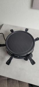 a black grill sitting on top of a table at bel appartement,confortable,2chambres in Briey +15 photos