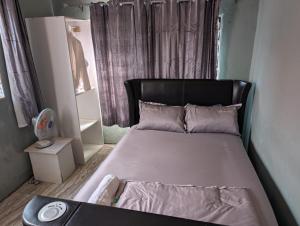 Postel nebo postele na pokoji v ubytování ISA guests house