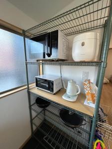Surf99一棟貸切80平米 一松海岸とコンビニ徒歩圏 200平米芝庭 BBQ 専用焚き火台 tesisinde mutfak veya mini mutfak