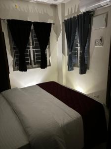 Postel nebo postele na pokoji v ubytování PS Elite Homestay