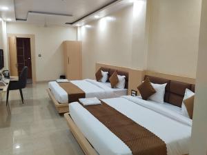 Hotel Grand Inn客房内的一张或多张床位