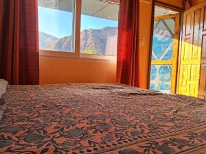 Postel nebo postele na pokoji v ubytování Devalsari Homestay