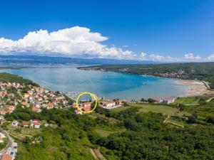 an aerial view of a lake with a yellow circle at Apartment Mirta by Interhome in Šilo