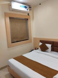 Hotel Grand Inn客房内的一张或多张床位