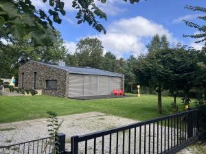 a small stone cottage in the middle of a yard at Holiday Home Villa Vrijheid by Interhome in Hollum +22 photos
