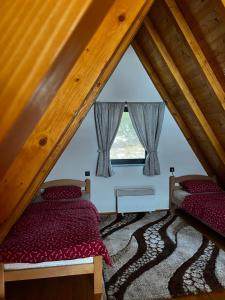 Postel nebo postele na pokoji v ubytování Vikendica Šumski mir Romanija