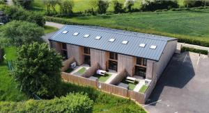 an overhead view of a building with a solar roof at Little Rissington - Barn Seven in Little Rissington