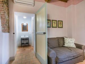 a living room with a couch and a table at Apartment Marruca by Interhome in Castiglioncello +36 photos