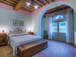 a bedroom with a bed and a large window at Apartment Marruca by Interhome in Castiglioncello