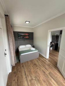 Postel nebo postele na pokoji v ubytování Pousada Kaki Haus + 29 fotografií