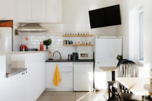 Kuchyňa alebo kuchynka v ubytovaní Arcus Premium Hostel