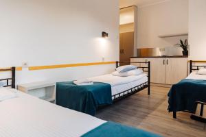 Posteľ alebo postele v izbe v ubytovaní Arcus Premium Hostel