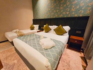 Postel nebo postele na pokoji v ubytování Carnarvon Suites By Reunion