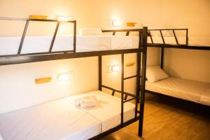 Postel nebo postele na pokoji v ubytování Grand'Hostel