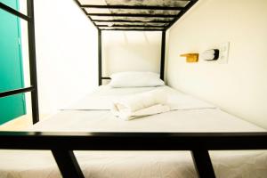 Postel nebo postele na pokoji v ubytování Grand'Hostel