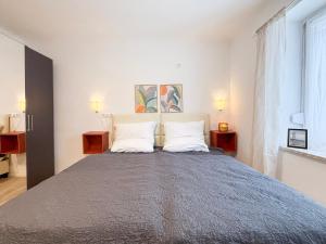 a bedroom with a large bed with two pillows at Relax Ferienwohnung Roetgen in Roetgen