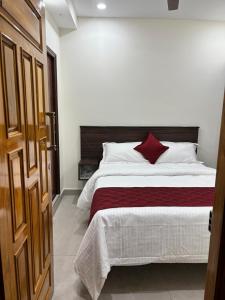 Postel nebo postele na pokoji v ubytování PS Elite Homestay