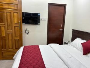 Postel nebo postele na pokoji v ubytování PS Elite Homestay