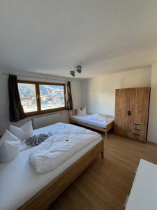 Postel nebo postele na pokoji v ubytování Apart Weitblick Suite