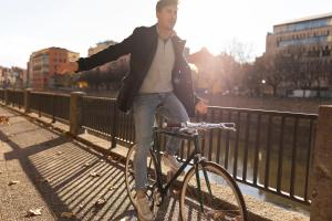 a man riding a bike on a bridge at Holiday Inn - the niu, Yen Hamburg City by IHG in Hamburg