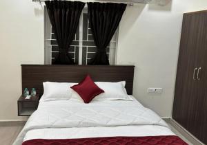 Postel nebo postele na pokoji v ubytování PS Elite Homestay