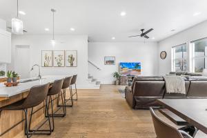 a kitchen and living room with a couch and a table at Villa #18 at Bloomington Country Club townhouse in St. George
