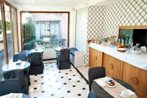 a restaurant with tables and chairs and a counter at Hotel Arco Di Travertino in Rome