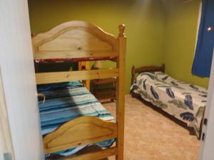 a bedroom with two bunk beds in a room at Km 9 in Viedma