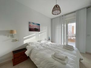 Posteľ alebo postele v izbe v ubytovaní Cozy apartment on the beach of Calpe + 17 fotografií