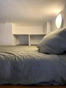 a bedroom with a bed with a pillow on it at Studio Biarritz Côte des Basques in Biarritz