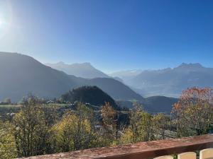 a view of a valley with mountains in the background at sport et repos à Leysin CH in Leysin