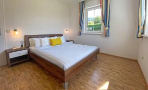 En eller flere senge i et værelse på Ferienwohnungen Sauerschnig