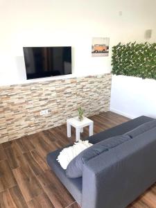 Telewizja i/lub zestaw kina domowego w obiekcie Apartamento Mar del norte, en Cotillo.