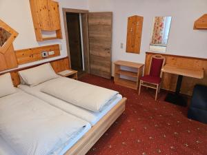 Łóżko lub łóżka w pokoju w obiekcie Pension Appartement Ambrosi