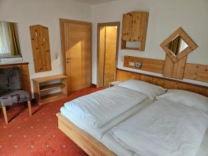 Łóżko lub łóżka w pokoju w obiekcie Pension Appartement Ambrosi