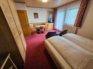 Łóżko lub łóżka w pokoju w obiekcie Pension Appartement Ambrosi