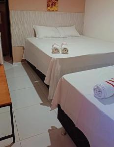 Katil atau katil-katil dalam bilik di pousada malva branca